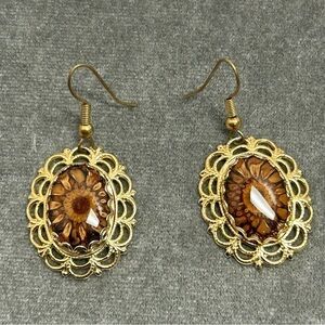 Gold tone flower cat eye oval dangling earrings